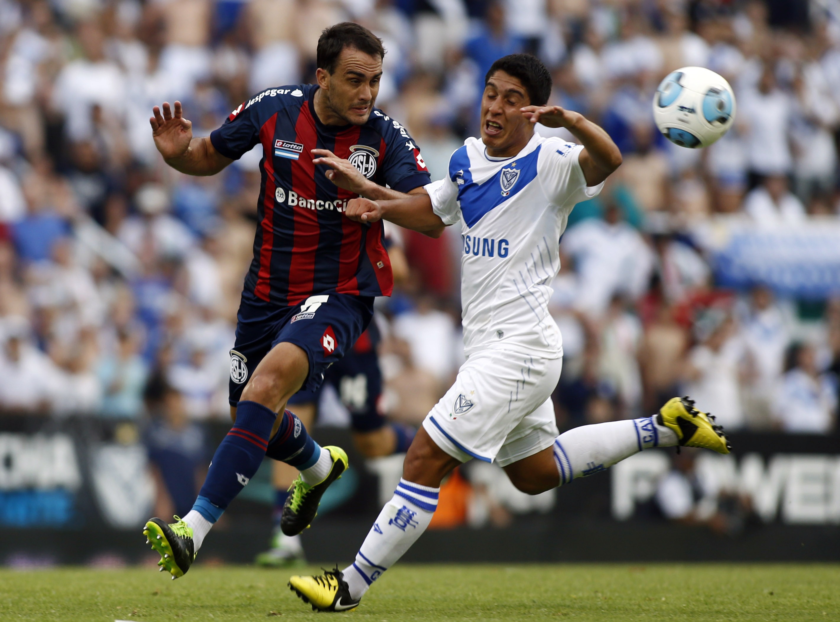 San Lorenzo's Gentiletti and Velez Sarsfield's Caseres fight for the ball during their Argentine First Division soccer match in Buenos Aires