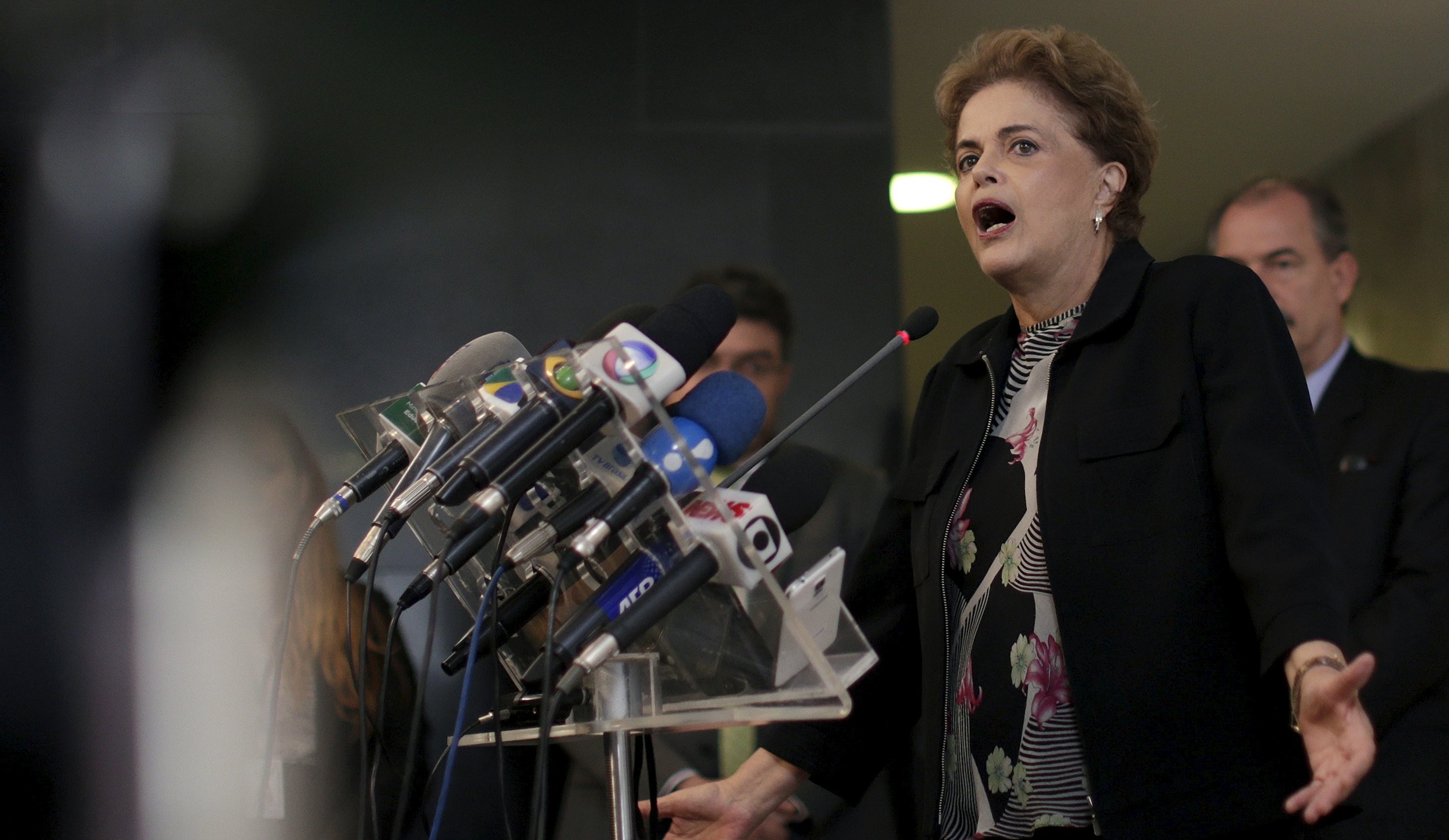 Rousseff reacts during a news conference in Brasilia